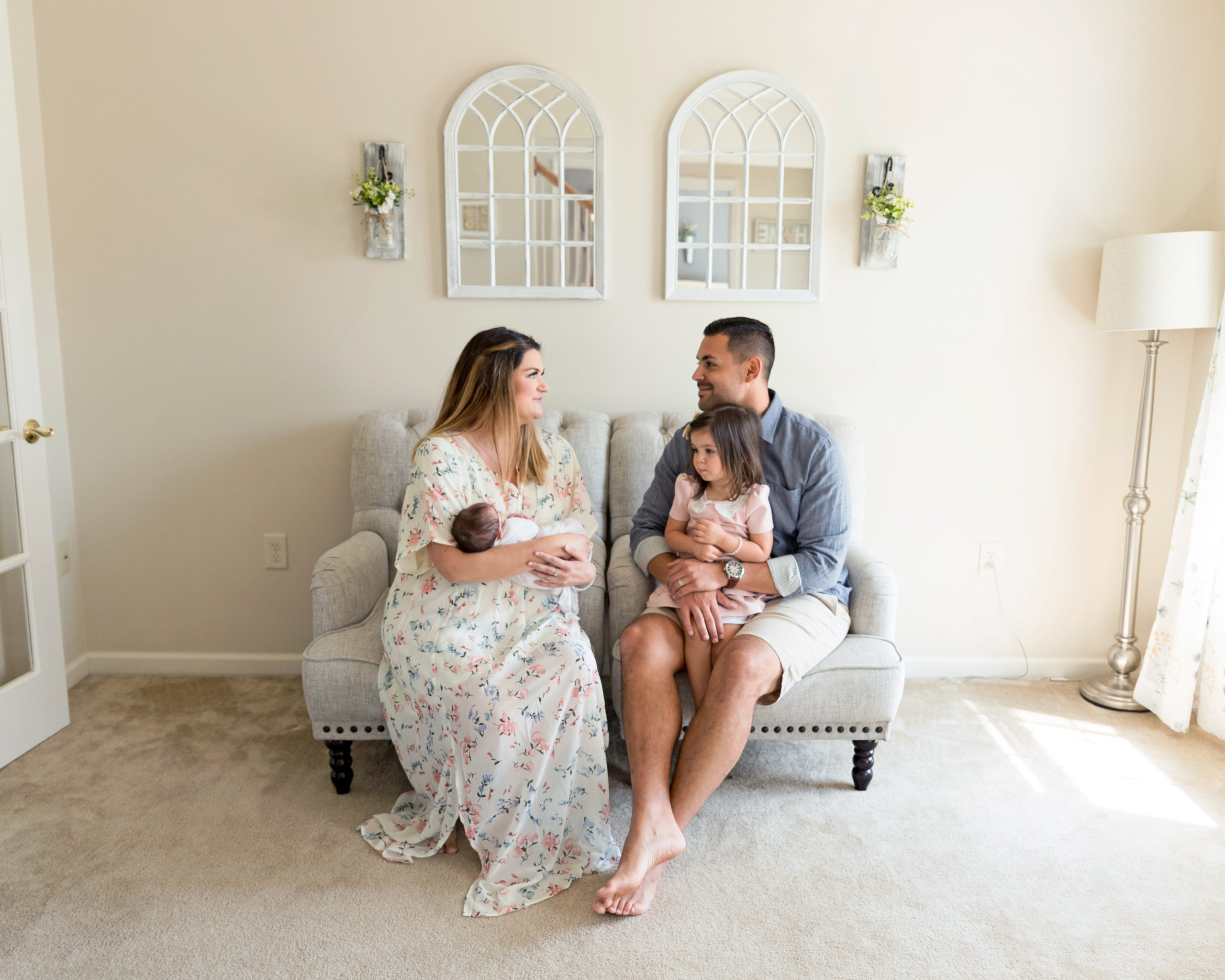 Lancaster Newborn Lifestyle Photography Session- Family sitting together with newborn baby and toddler