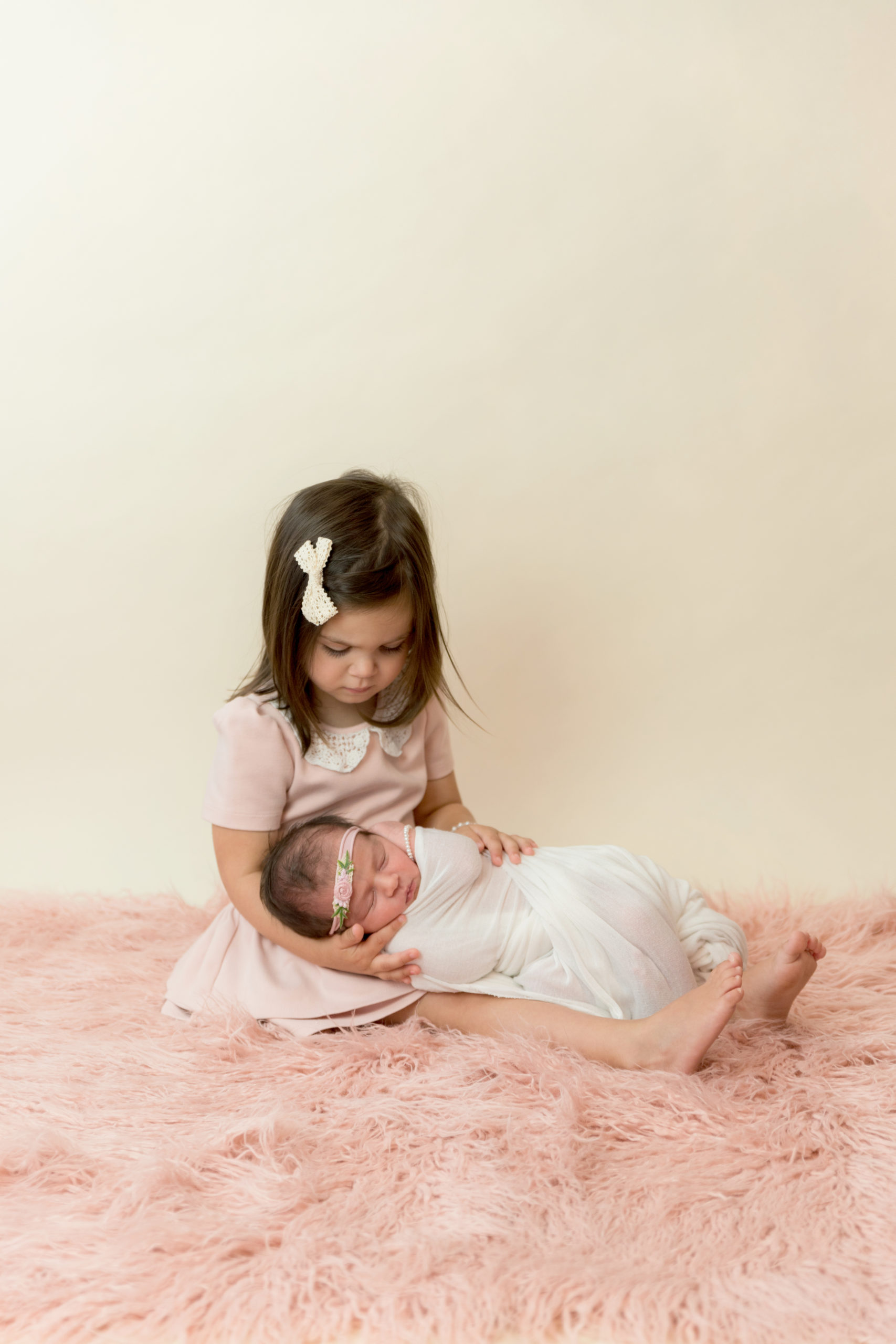 Lancaster Newborn Photography Session-Posed Photography Older Sister holding baby sister