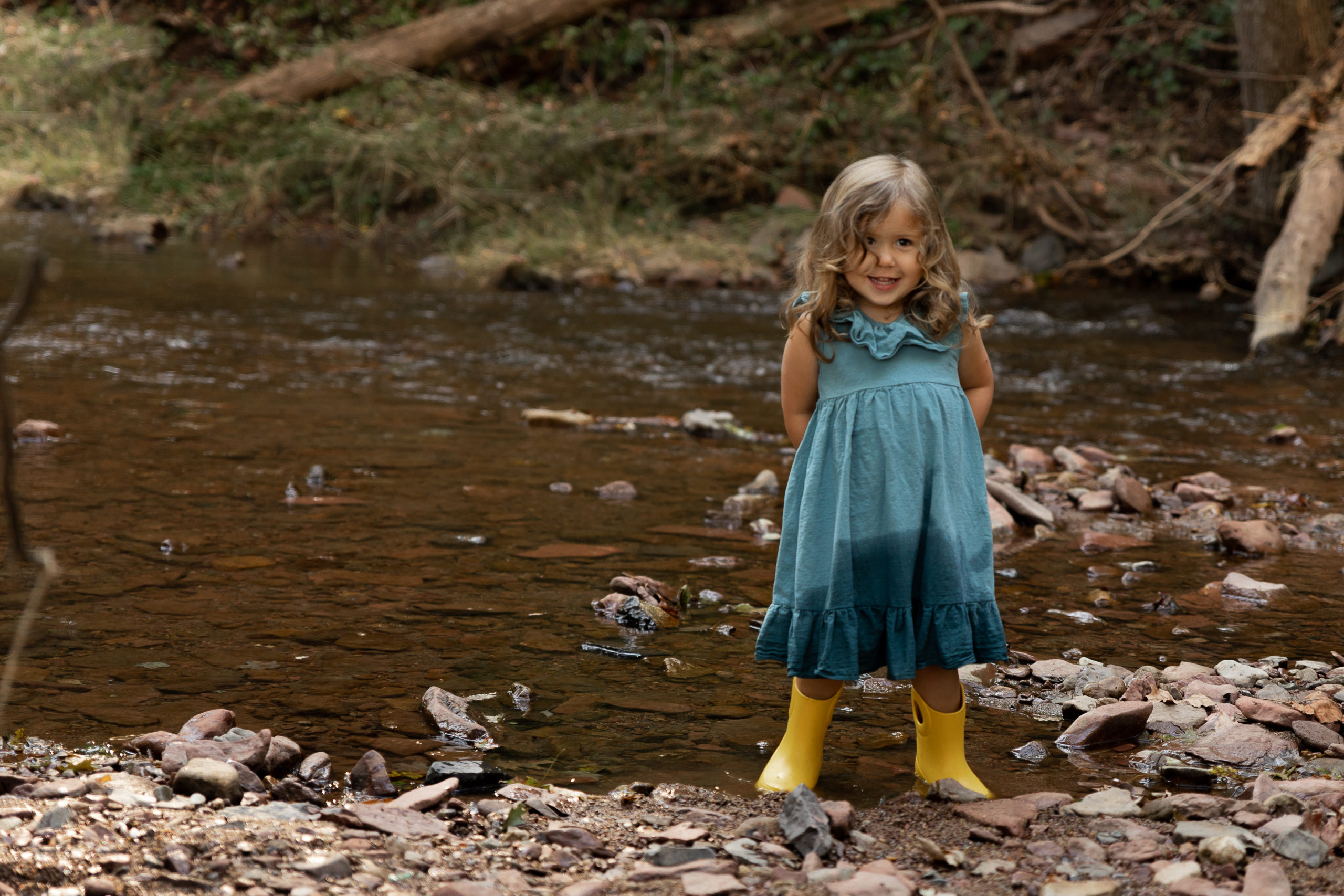 Little girl in rain boots Creek stomping things to do with kids in Philadelphia